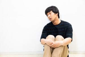 面倒くさがる男性