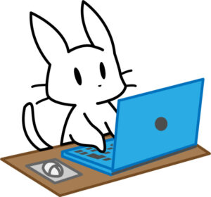 パソコン作業する白猫